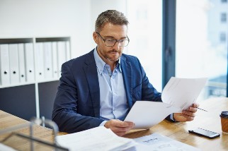 Businessman reading paperwork