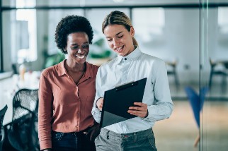 Two businesswomen meeting in a conference room