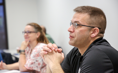 Middle-age male safety professional sharing information