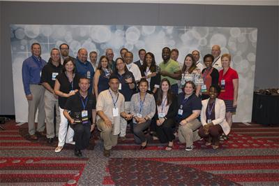 Three individuals looking up. 