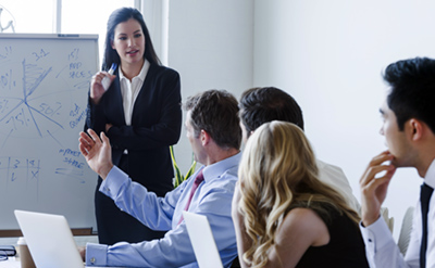 Female safety professional consulting with corporate team