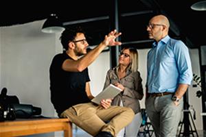 Team lead standing in front of workers