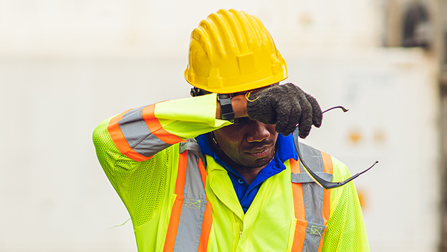 Worker in Hi-Viz Gear Wiping Sweat From Forehead-635